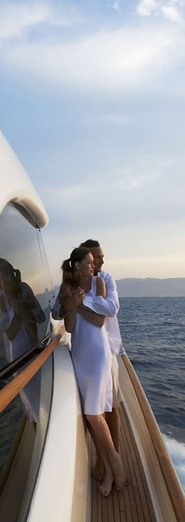 Couple Standing on starboard side on Mochi Yacht
